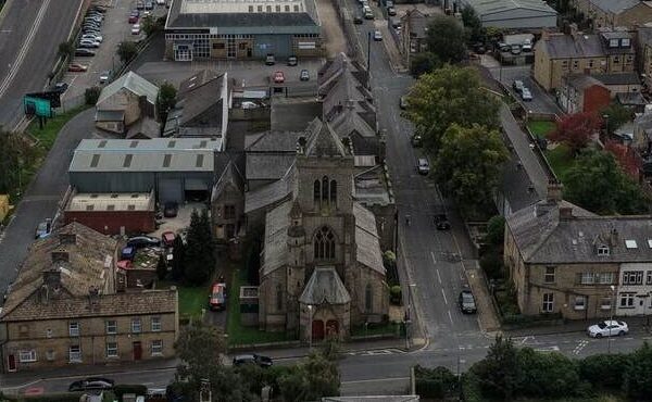 St Mary’s Church Halifax – aerial overview Aerial drone photograph showing St Mary’s Church in Halifax, including the main roof, tower and surrounding roof sections.